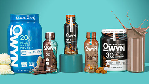 various OWYN products with scoop of vanilla ice cream, chocolate bars, caramel cubes a glass of chocolate milk in the teal background.