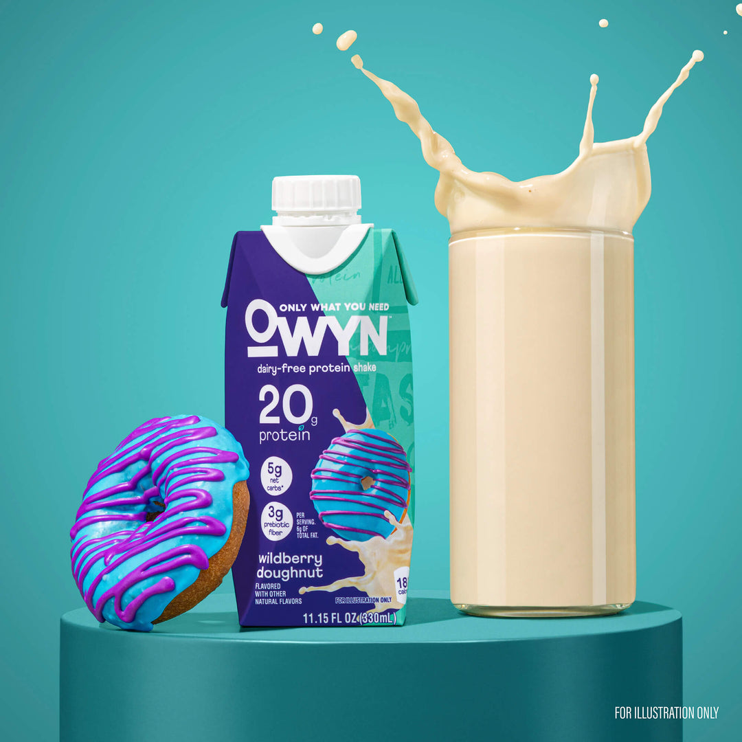 Dairy-free protein shake carton labeled "OWYN" with a wildberry doughnut pictured, alongside a glass with a splash. Vibrant background; lively, fresh tone.
